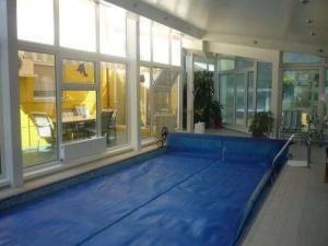 inside pool room with big windows